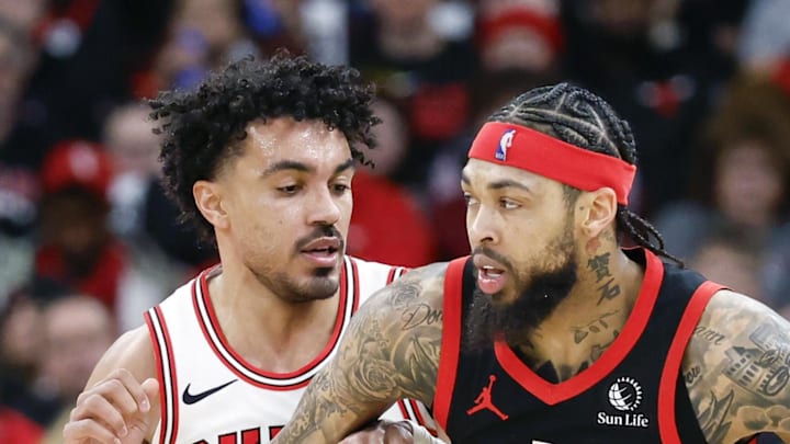 Chicago Bulls guard Tre Jones defends against Toronto Raptors forward Brandon Ingram.