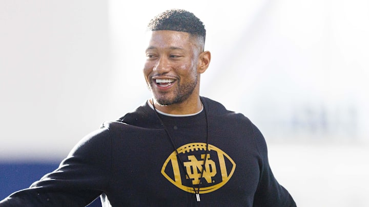Notre Dame head coach Marcus Freeman greets his players during a Notre Dame football spring practice