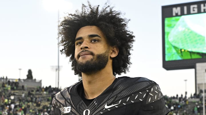 Nov 22, 2025; Eugene, Oregon, USA; Oregon Ducks quarterback Dante Moore (5) walks off the field after the game against the Southern California Trojans at Autzen Stadium. Mandatory Credit: Troy Wayrynen-Imagn Images