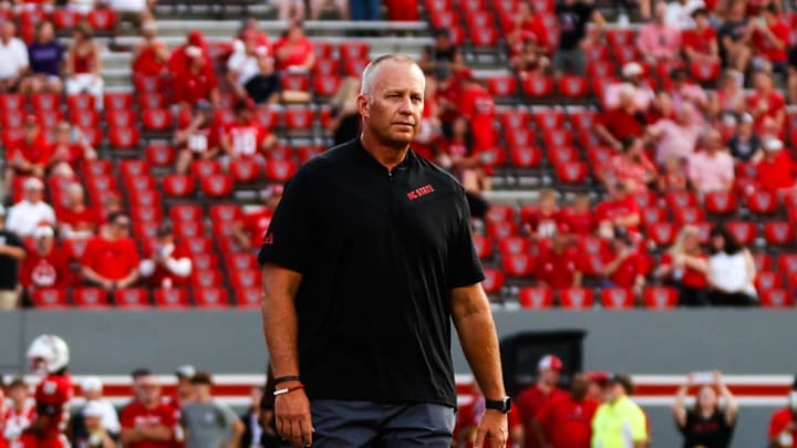 Aug 29, 2024; Raleigh, North Carolina, USA; North Carolina State Wolfpack head coach Dave Doeren between his players before the first half of the game against Western Carolina Catamounts at Carter-Finley Stadium. Mandatory Credit: Jaylynn Nash-Imagn Images Aug 29, 2024; Raleigh, North Carolina, USA; North Carolina State Wolfpack head coach Dave Doeren between his players before the first half of the game against Western Carolina Catamounts at Carter-Finley Stadium. Mandatory Credit: Jaylynn Nash-Imagn Images