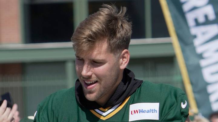 Green Bay Packers defensive end Lukas van Ness (90) rides a scooter during the first day of training camp Wednesday, July 29, 2026 in Green Bay, Wisconsin. It is the first of three consecutive public practices. The tradition of players riding children’s bikes to practice dates back to the era when Vince Lombardi was head coach.
