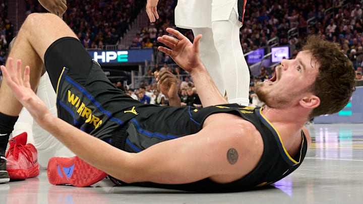 Nov 21, 2025; San Francisco, California, USA; Golden State Warriors center Quinten Post (21) reacts to a call by referee J.B. DeRosa (not pictured) during the third quarter against the Portland Trail Blazers at Chase Center. Mandatory Credit: Robert Edwards-Imagn Images