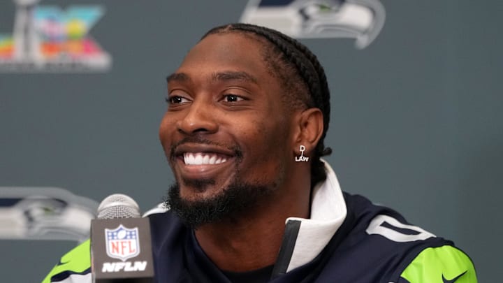 Seattle Seahawks defensive end DeMarcus Lawrence talks to media members