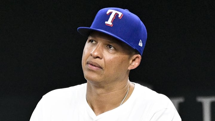 Jun 3, 2024; Arlington, Texas, USA; Texas Rangers associate manager Will Venable (83) watches from the dugout during the fourth inning against the Detroit Tigers at Globe Life Field. Venable fills in as acting manager for manager Bruce Bochy (not pictured) who misses game due to person reasons