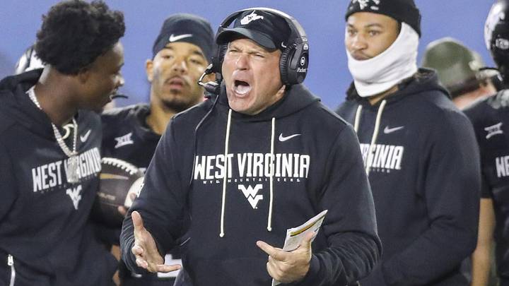 Oct 25, 2025; Morgantown, West Virginia, USA; West Virginia Mountaineers head coach Rich Rodriguez yells from the sideline late in the second quarter against the Texas Christian University Horned Frogs at Milan Puskar Stadium. Mandatory Credit: Ben Queen-Imagn Images