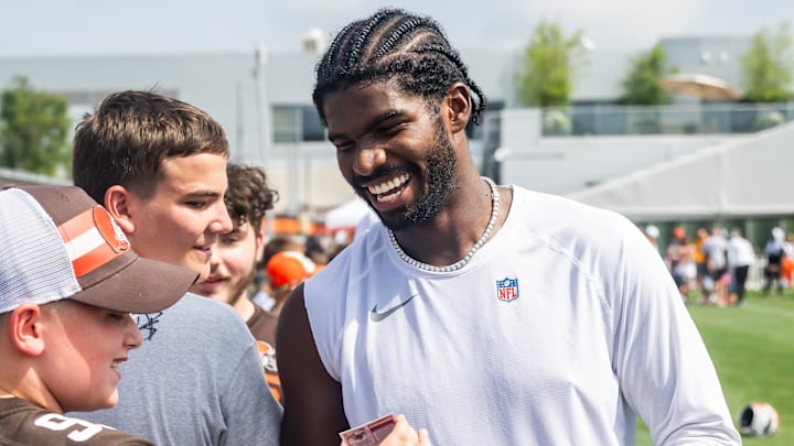Jul 26, 2025; Berea, OH, USA; Cleveland Browns quarterback Shedeur Sanders (12) talks to a fan during training camp at CrossCountry Mortgage Campus. 