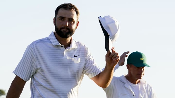 Apr 13, 2024; Augusta, Georgia, USA; Scottie Scheffler tips his hat to patrons as he walks off the