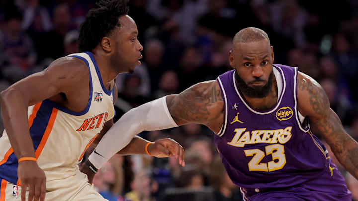 Feb 1, 2026; New York, New York, USA; Los Angeles Lakers forward LeBron James (23) drives to the basket against New York Knicks forward OG Anunoby (8) during the third quarter at Madison Square Garden.