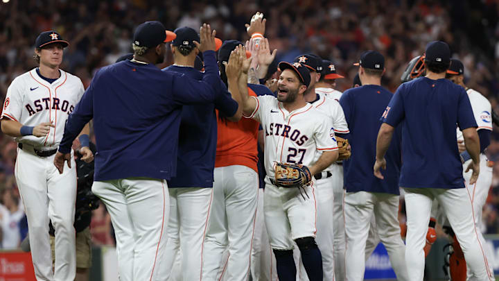 Sep 24, 2024; Houston, Texas, USA; Houston Astros second baseman Jose Altuve (27) and teammates celebrate defeating the Seattle Mariners and winning the American League West at Minute Maid Park