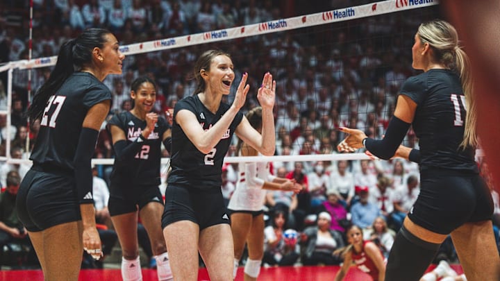 Nebraska volleyball players celebrate a point at Wisconsin. The Huskers won all three matches against the Badgers last season in straight sets. 