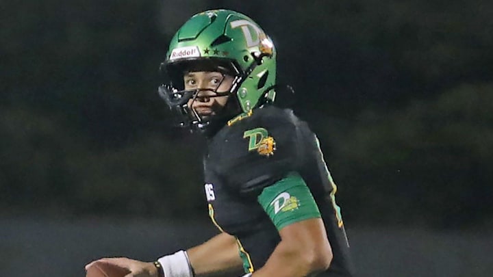DeLand quarterback Gardner Nordman (4) looks for an open player down the field during a game against Mainland on Oct. 3. The Bulldogs won 28-20 and moved up to No. 4 in this week's High School on SI Central Florida Football Top 10 Rankings.