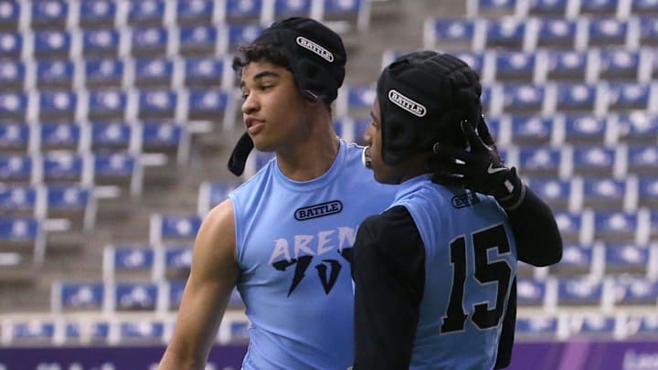 Arena Elite 15U’s Kasen Thomas (9), left, celebrates a teammate’s touchdown during a 7-on-7 football tournament Saturday, April 13, 2024 at the UNI Dome in Cedar Falls, Iowa.