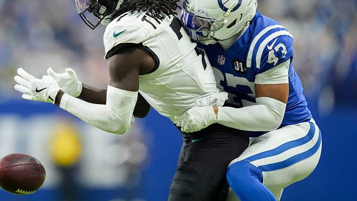 Indianapolis Colts cornerback Cameron Mitchell (43) breaks up a pass intended for Jacksonville Jaguars wide receiver Brian Thomas Jr. (7) on Sunday, Dec. 28, 2025, during a game at Lucas Oil Stadium in Indianapolis.