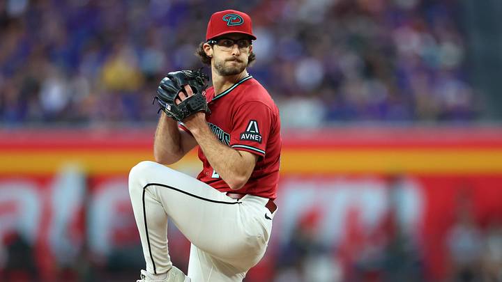 May 23, 2026; Phoenix, Arizona, USA; Arizona Diamondbacks pitcher Zac Gallen (23) prepares to throw a pitch against the Colorado Rockies during the first inning at Chase Field. Mandatory Credit: Anna Carrington-Imagn Images