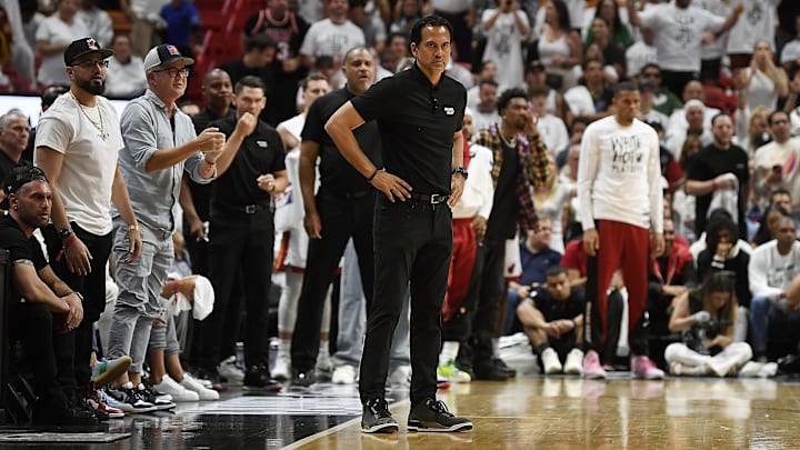 Apr 29, 2024; Miami, Florida, USA; Miami Heat coach Erik Spoelstra, center, watches the Boston Celtics pull ahead of the Heat during the second quarter of game four of the first round for the 2024 NBA playoffs at Kaseya Center. Mandatory Credit: Michael Laughlin-Imagn Images