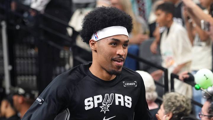 Apr 12, 2026; San Antonio, Texas, USA; San Antonio Spurs guard Dylan Harper (2) greets fans while entering the court before a game against the Denver Nuggets at Frost Bank Center. Mandatory Credit: Scott Wachter-Imagn Images