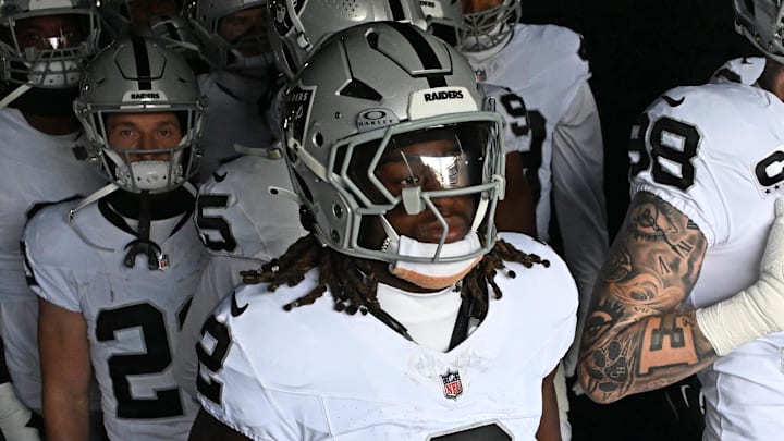 Dec 14, 2025; Philadelphia, Pennsylvania, USA; Las Vegas Raiders running back Ashton Jeanty (2) and defensive end Maxx Crosby (98) in the tunnel against the Philadelphia Eagles at Lincoln Financial Field. Mandatory Credit: Eric Hartline-Imagn Images