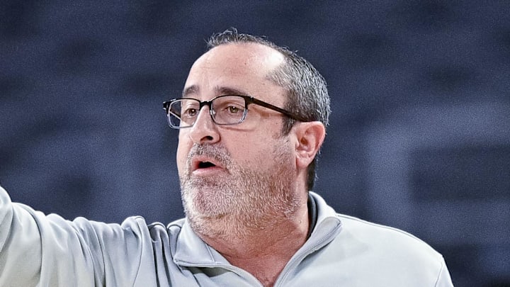 South Florida Bulls head coach Jose Fernandez motions to his team during the first half.