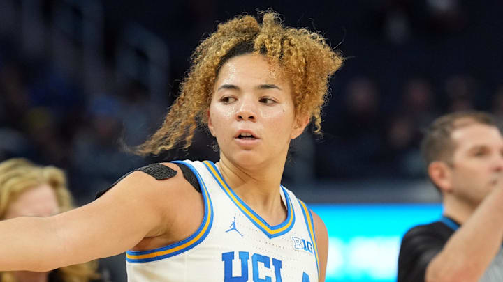 Dec 20, 2024; San Francisco, California, USA; UCLA Bruins guard Kiki Rice (1) gestures after making a three point basket against the Creighton Bluejays during the third quarter at Chase Center. Mandatory Credit: Darren Yamashita-Imagn Images