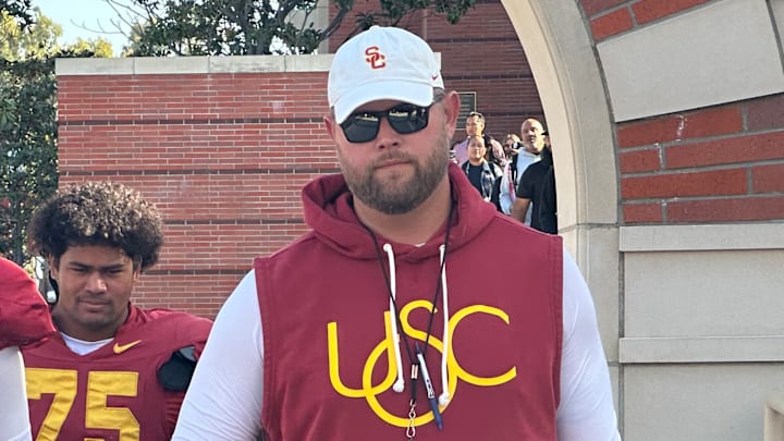 USC Trojans offensive line coach Zach Hanson and freshman offensive tackle Chase Deniz