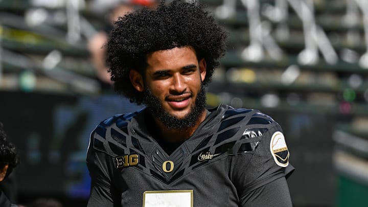 Sep 20, 2025; Eugene, Oregon, USA; Oregon Ducks quarterback Dante Moore (5) warms up before the game against the Oregon State Beavers at Autzen Stadium. Mandatory Credit: Troy Wayrynen-Imagn Images