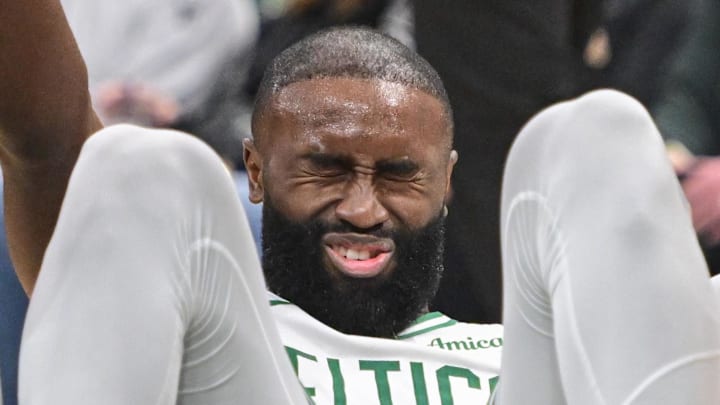 Apr 3, 2026; Milwaukee, Wisconsin, USA;  Boston Celtics forward Jaylen Brown (7) is helped up after a foul in the third quarter against the Milwaukee Bucks at Fiserv Forum. Mandatory Credit: Benny Sieu-Imagn Images