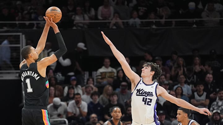 Feb 21, 2026; Austin, Texas, USA;  San Antonio Spurs forward Victor Wembanyama (1) shoots over Sacramento Kings center Maxime Raynaud (42) in the second half at Moody Center. Mandatory Credit: Daniel Dunn-Imagn Images