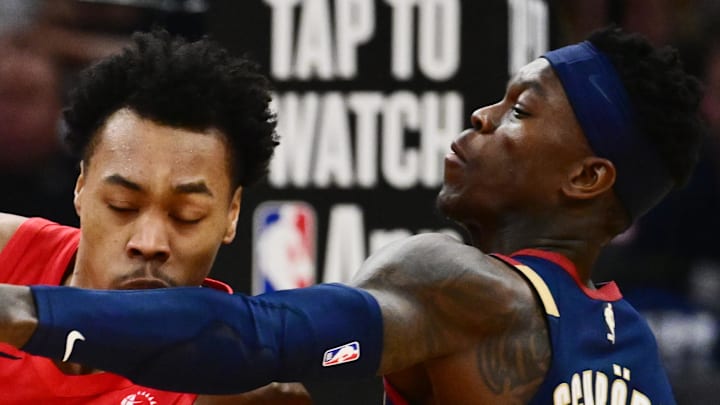 Cleveland Cavaliers guard Dennis Schroder defends Toronto Raptors forward Scottie Barnes.