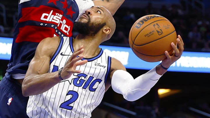 Mar 3, 2026; Orlando, Florida, USA;  Orlando Magic guard Jevon Carter (2) goes up for a shot as Washington Wizards forward Justin Champagnie (9) defends in the second half at Kia Center. Mandatory Credit: Russell Lansford-Imagn Images