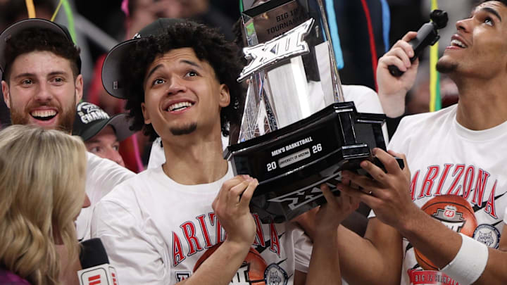 Mar 14, 2026; Kansas City, MO, USA; The Arizona Wildcats celebrate after defeating the Houston Cougars during the men's Big 12 Conference Tournament Championship at T-Mobile Center. Mandatory Credit: William Purnell-Imagn Images