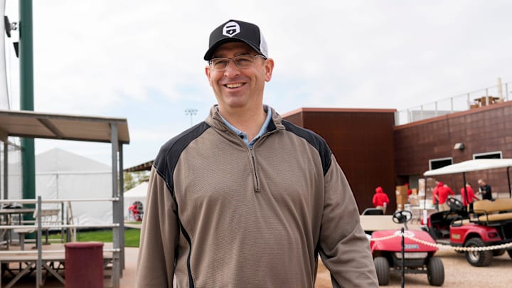 Reds president of baseball operations Nick Krall walks between fields at the Cincinnati Reds Player Development Complex in Goodyear, Ariz., on Wednesday, Feb. 12, 2025.