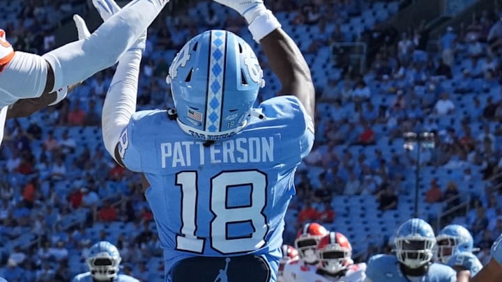 Oct 4, 2025; Chapel Hill, North Carolina, USA; North Carolina Tar Heels defensive back Jaiden Patterson (18) breaks up a pass intended for Clemson Tigers wide receiver Tristan Smith (3) in the fourth quarter at Kenan Stadium. Mandatory Credit: Bob Donnan-Imagn Images