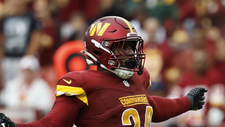 Washington Commanders outside linebacker Von Miller celebrates with Commanders linebacker Frankie Luvu.