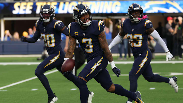 Derwin James celebrates with teammates after an interception. Derwin James celebrates with teammates after an interception.