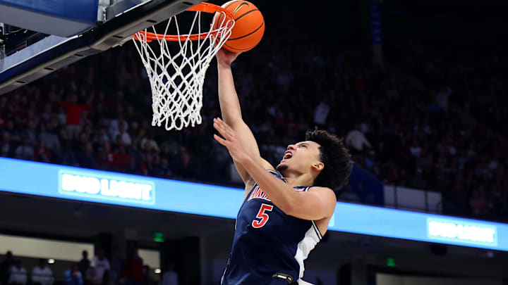 Dec 13, 2025; Birmingham, Alabama, USA; Arizona Wildcats guard Brayden Burries (5) makes a layup during the second half against the Alabama Crimson Tide at Legacy Arena at BJCC. Mandatory Credit: David Leong-Imagn Images