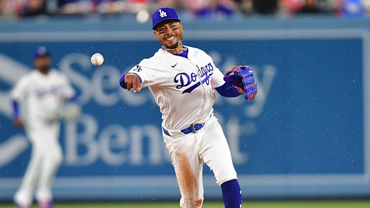 Mar 31, 2026; Los Angeles, California, USA; Los Angeles Dodgers shortstop Mookie Betts (50) throws to first for the out against Cleveland Guardians shortstop Gabriel Arias (13) during the fifth inning at Dodger Stadium. Mandatory Credit: Gary A. Vasquez-Imagn Images
