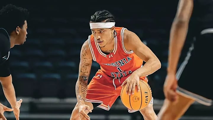 Jared Cooper scores 29 points to led the Trojans to a 69-66 victory at the BCIC Championship. Jared Cooper scores 29 points to led the Trojans to a 69-66 victory at the BCIC Championship.