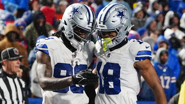 Dec 17, 2023; Orchard Park, New York, USA; Dallas Cowboys wide receiver CeeDee Lamb (88) celebrates a touchdown with Dallas Cowboys wide receiver Jalen Tolbert (18) in the second half against the Buffalo Bills at Highmark Stadium. Mandatory Credit: Gregory Fisher-Imagn Images