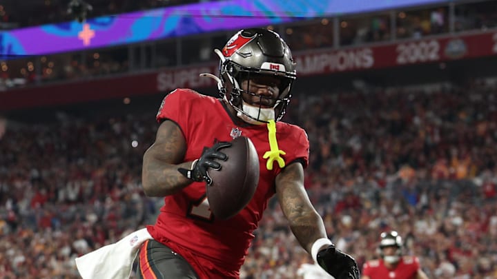 Tampa Bay Buccaneers running back Bucky Irving makes a touchdown catch against Washington Commanders linebacker Frankie Luvu.