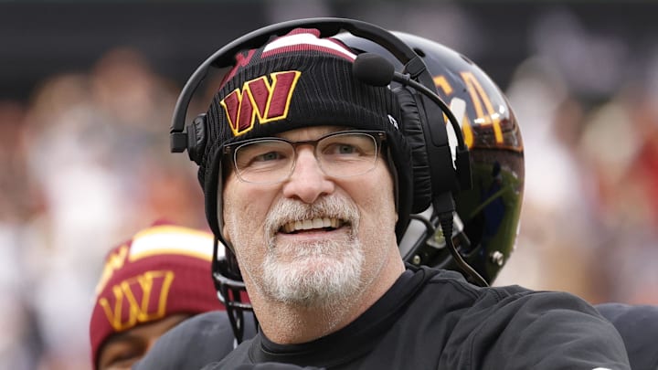 Dec 1, 2024; Landover, Maryland, USA; Washington Commanders head coach Dan Quinn (right) celebrates with Commanders running back Brian Robinson Jr. (8) after scoring a touchdown against the Tennessee Titans during the first half at Northwest Stadium. Mandatory Credit: Amber Searls-Imagn Images