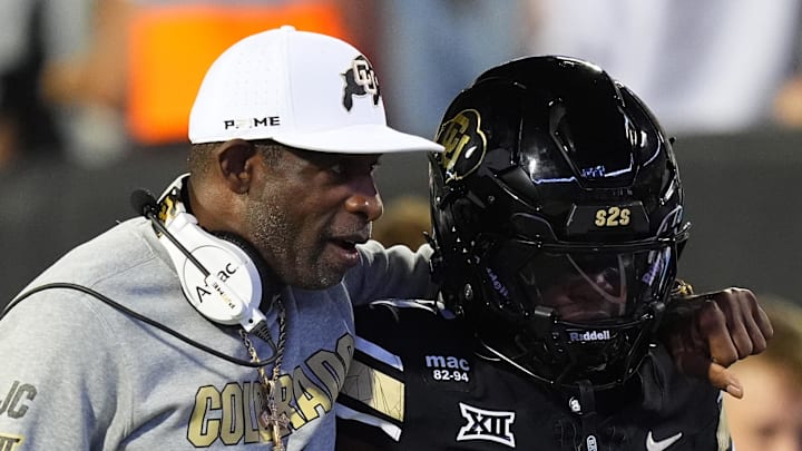Sep 20, 2025; Boulder, Colorado, USA; Colorado Buffaloes head coach Deion Sanders and wide receiver Isaiah Hardge (17) during the first quarter against the Wyoming Cowboys at Folsom Field.