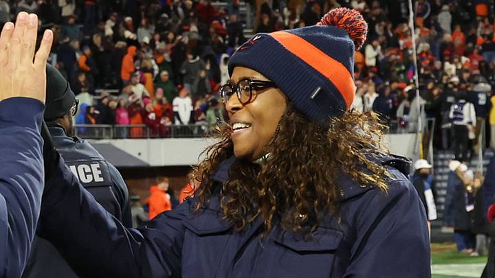 Nov 29, 2025; Charlottesville, Virginia, USA; Virginia Cavaliers head coach Tony Elliott (L) celebrates with Virginia director of athletics Carla Williams (R) on the field after the Cavaliers' game against the Virginia Tech Hokies at Scott Stadium. Mandatory Credit: Geoff Burke-Imagn Images Nov 29, 2025; Charlottesville, Virginia, USA; Virginia Cavaliers head coach Tony Elliott (L) celebrates with Virginia director of athletics Carla Williams (R) on the field after the Cavaliers' game against the Virginia Tech Hokies at Scott Stadium. Mandatory Credit: Geoff Burke-Imagn Images