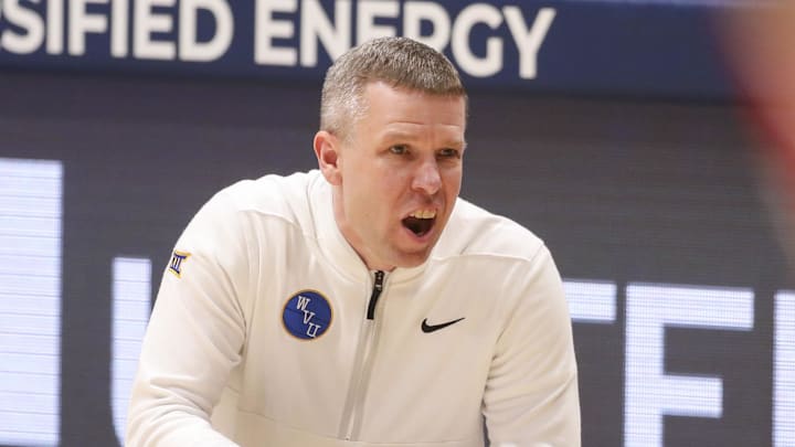 Feb 18, 2026; Morgantown, West Virginia, USA; West Virginia Mountaineers head coach Ross Hodge yells from the sideline during the first half against the Utah Utes at Hope Coliseum. Mandatory Credit: Ben Queen-Imagn Images