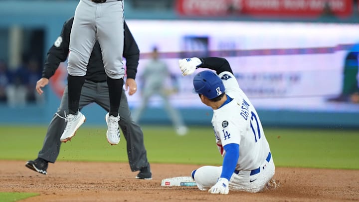 Apr 29, 2025; Los Angeles, California, USA; Los Angeles Dodgers designated hitter Shohei Ohtani (17) steals second under Miami Marlins second baseman Otto Lopez (6) during the second inning at Dodger Stadium. 