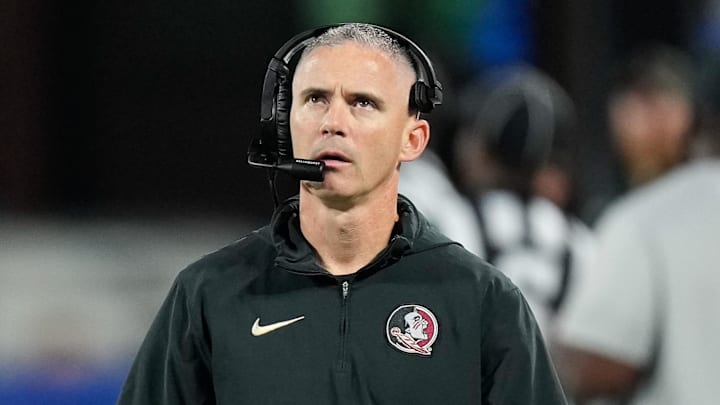Dec 2, 2023; Charlotte, NC, USA;  Florida State Seminoles head coach Mike Norvell walks the sidelines during the third quarter against the Louisville Cardinals at Bank of America Stadium. Mandatory Credit: Jim Dedmon-Imagn Images