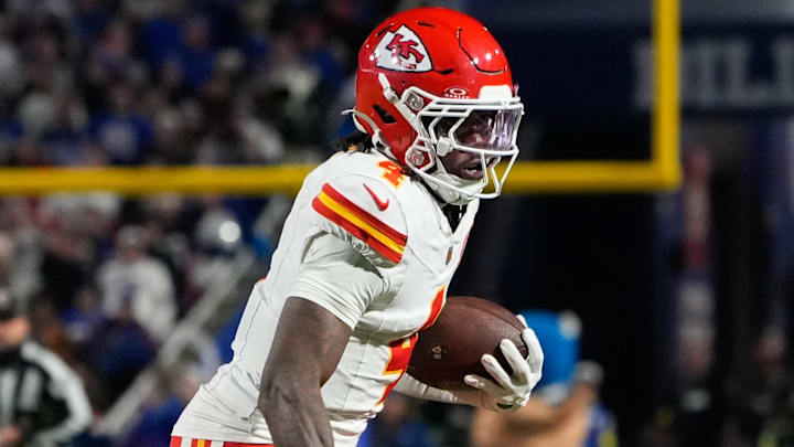 Nov 2, 2025; Orchard Park, New York, USA; Kansas City Chiefs wide receiver Rashee Rice (4) runs with the ball in the second half against the Buffalo Bills at Highmark Stadium. Mandatory Credit: Gregory Fisher-Imagn Images