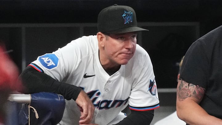 May 21, 2025; Miami, Florida, USA;  Miami Marlins manager Clayton McCullough (86) looks on from the dugout during the fourth inning against the Chicago Cubs at loanDepot Park. Mandatory Credit: Jim Rassol-Imagn Images