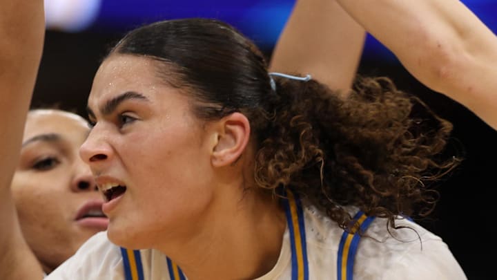 Connecticut Huskies forward Ice Brady defends against UCLA Bruins center Lauren Betts