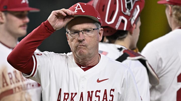 Arkansas coach Dave Van Horn walks off the mound at the College Baseball Series against the Michigan Wolverines in Arlington, Texas. The Razorbacks won 8-6. Arkansas coach Dave Van Horn walks off the mound at the College Baseball Series against the Michigan Wolverines in Arlington, Texas. The Razorbacks won 8-6.