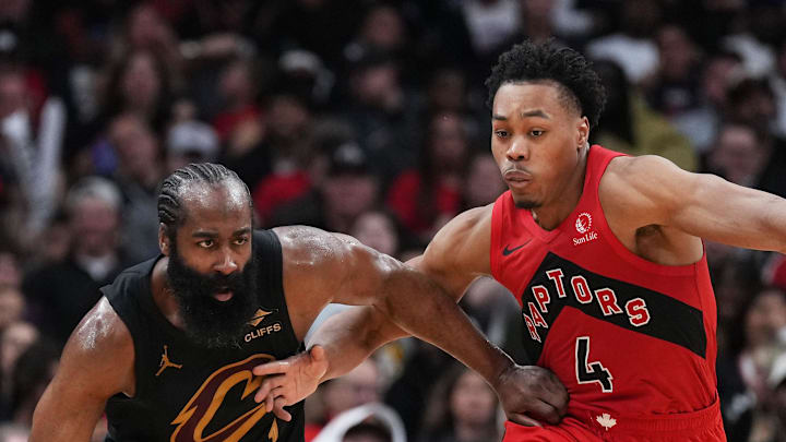 Cleveland Cavaliers guard James Harden battles with Toronto Raptors forward Scottie Barnes.